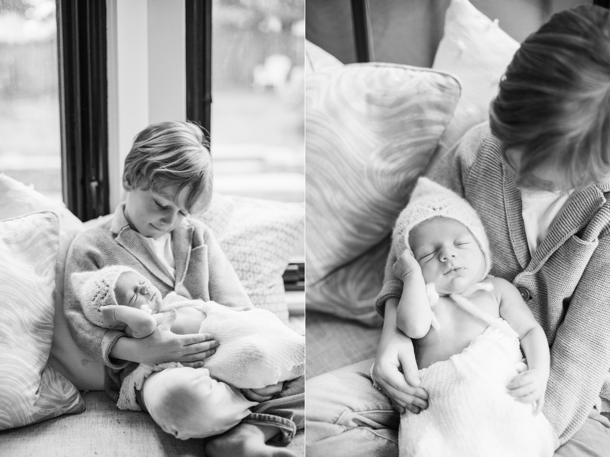 Black and white images of big brother holding baby. Photo by LRG Portraits.