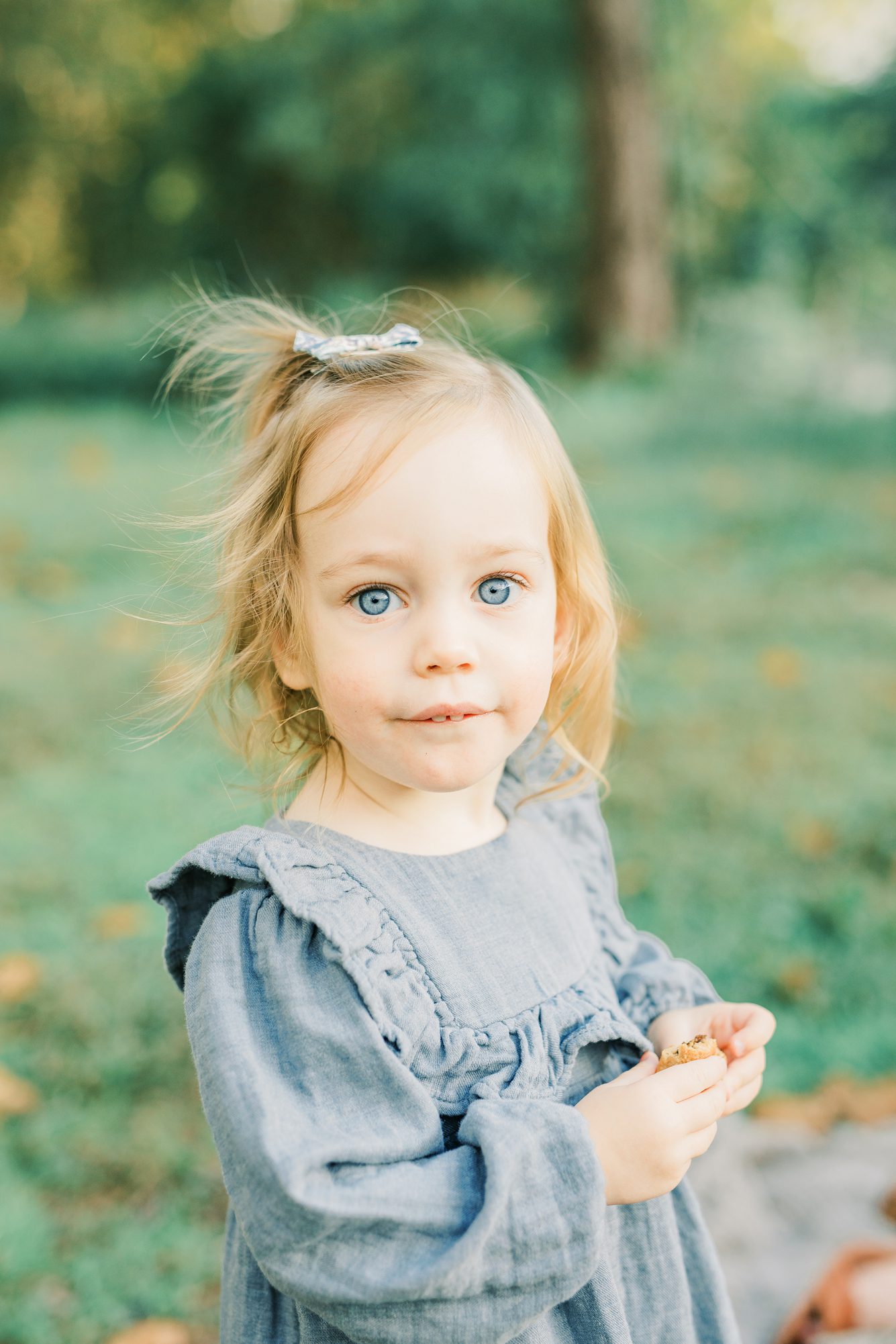 Closeup of little girl in park. Photo by LRG Portraits.
