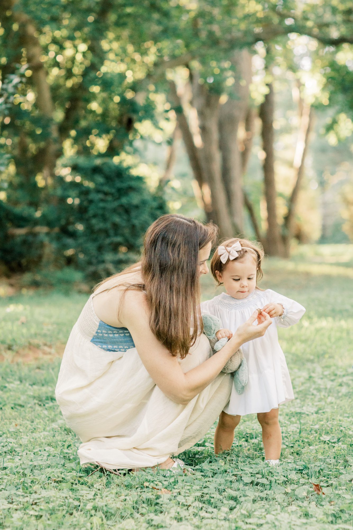 Mom and daughter exploring together during family session. Photo by LRG Portraits.