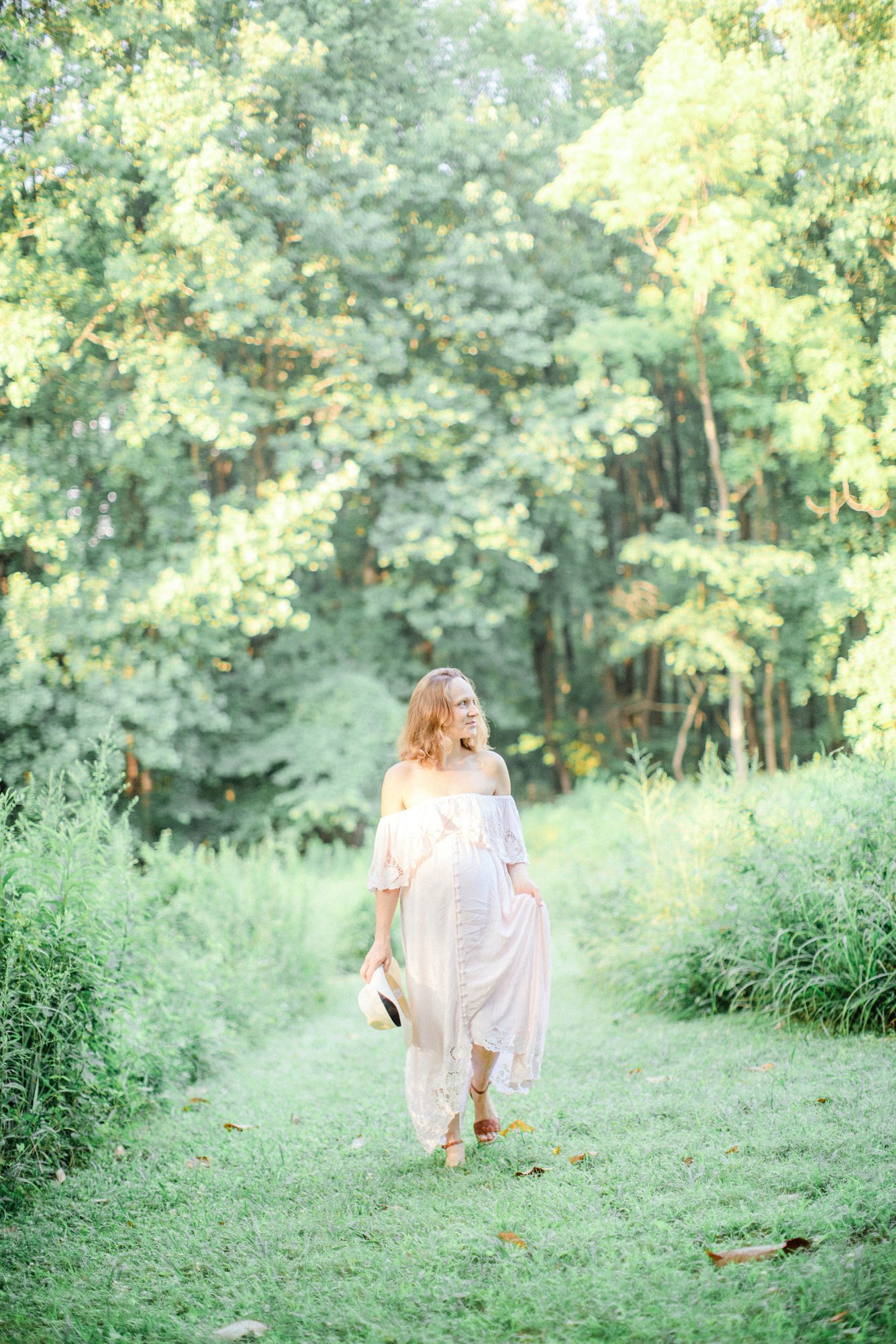 Maternity session in field during golden hour in Chevy Chase MD. Photo by LRG Portraits.