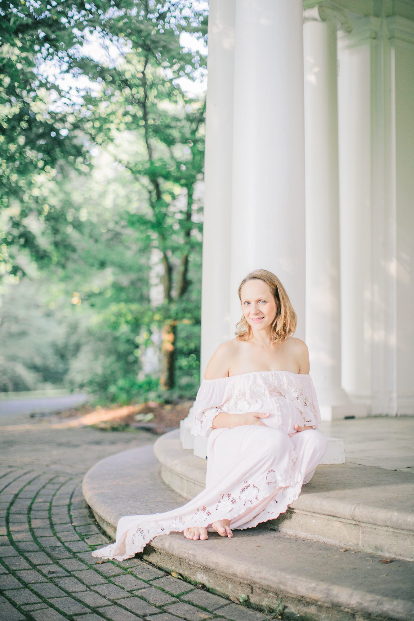 Pregnant Mom sitting on steps of Woodend Sanctuary in Chevy Chase MD. Photo by LRG Portraits.